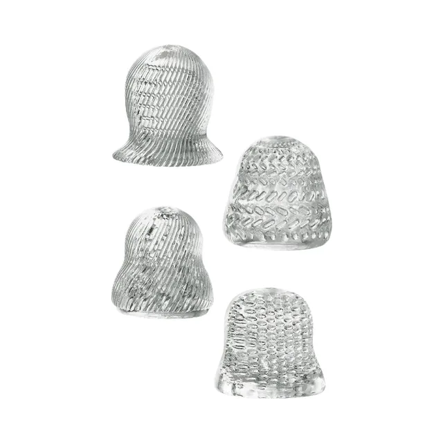 Four translucent gray stroker sleeves with different patterns
