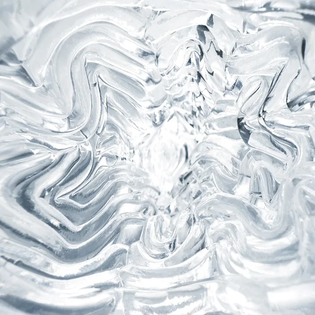 TENGA GEO Aqua clear stroker close-up of the flowing wavy internal ridges