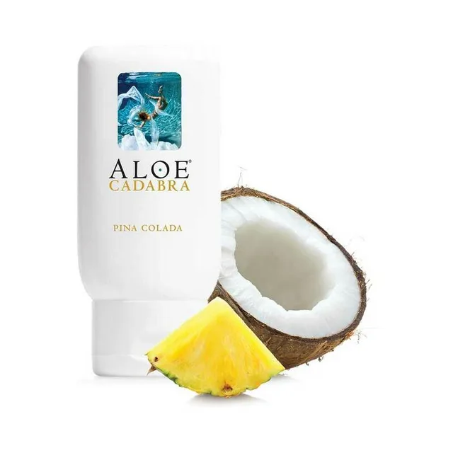 white Aloe Cadabra Pina Colada lubricant bottle with coconut and pineapple pieces