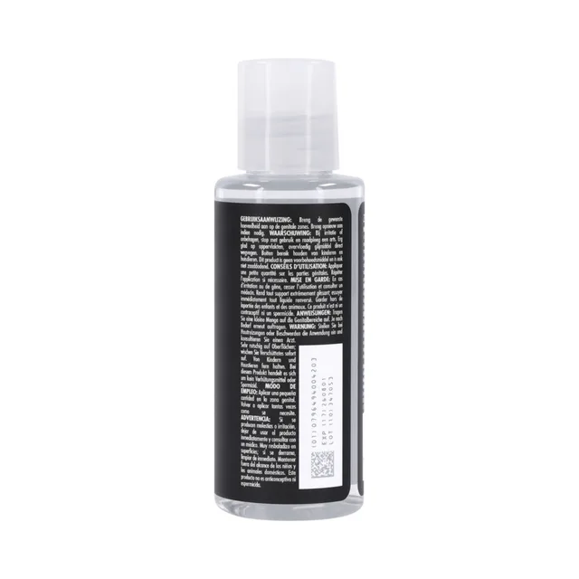 Side view of Drenched Warmth 2 fl oz bottle with multilingual label