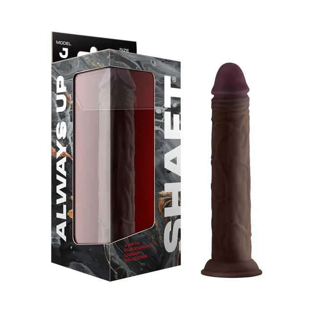 mahogany Shaft Model J 9.5-inch dildo beside black retail box