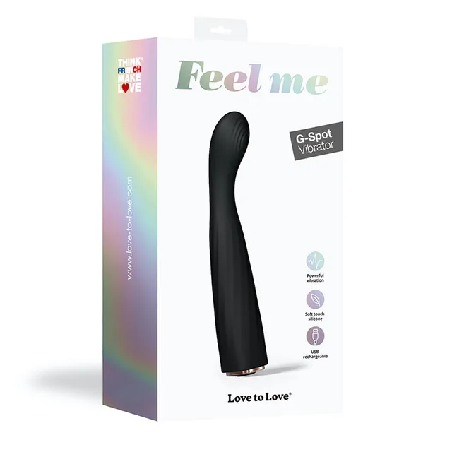 Black curved Feel Me vibrator beside white Love to Love retail box