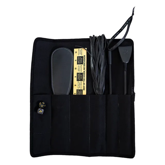 Open black roll-up organizer holding the Correction Collection tools