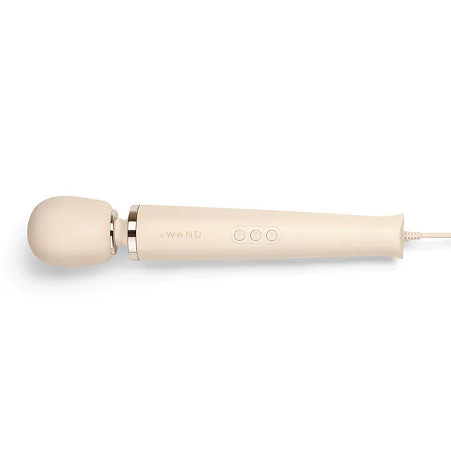 Side view of cream Le Wand round head and three-button handle