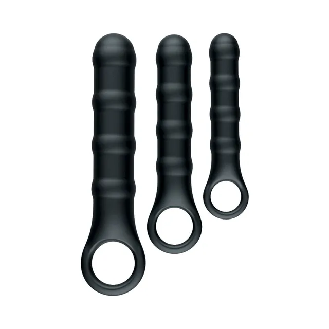 Three graduated black Ass-Sation ribbed wands standing upright