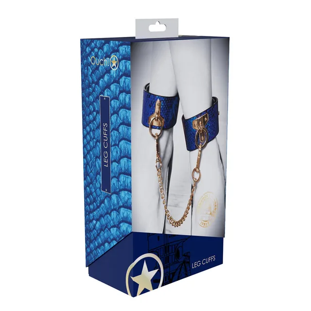 blue and black snakeskin Florence leg cuffs with gold chain on box