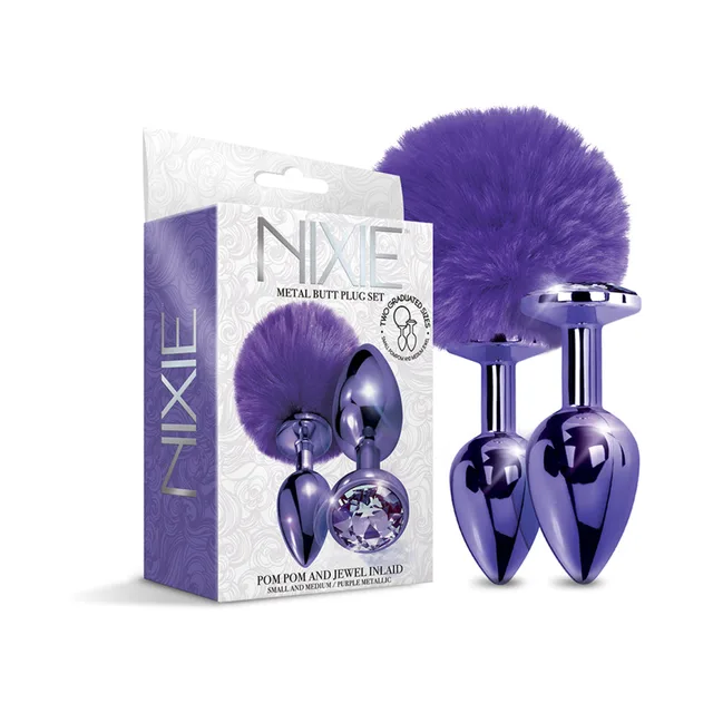 Metallic purple NIXIE pom pom and jewel plugs beside white box