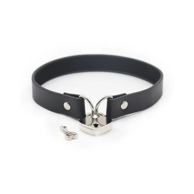 Black PVC collar fastened with heart lock and matching key