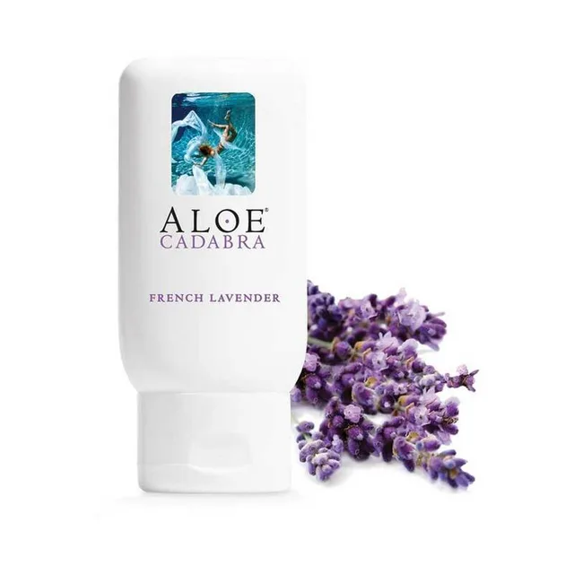 white Aloe Cadabra French Lavender lubricant bottle beside purple lavender flowers
