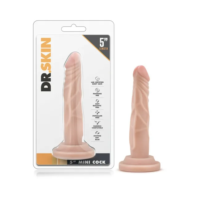 Blush Dr. Skin Mini Cock Beige 5 Inch Dildo beside clear retail package