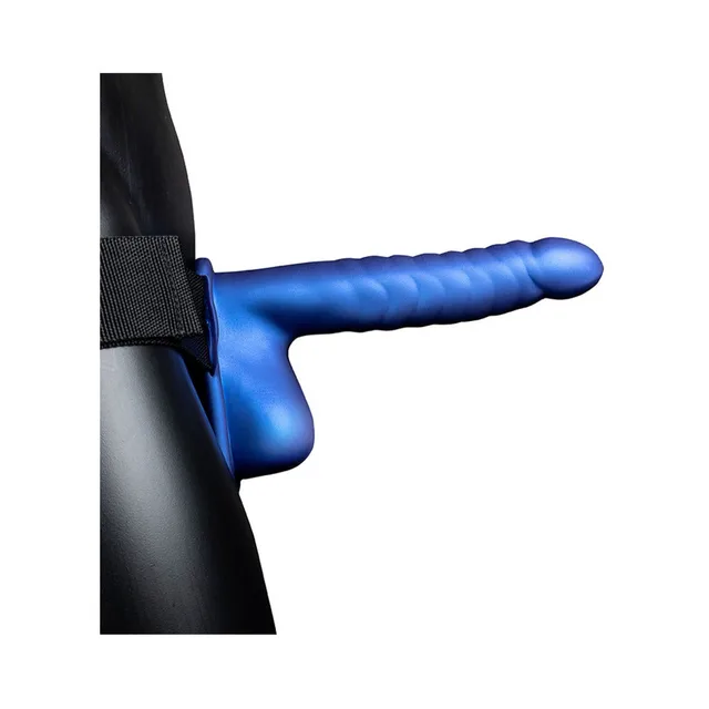 Blue ribbed 8-inch strap-on worn with black harness