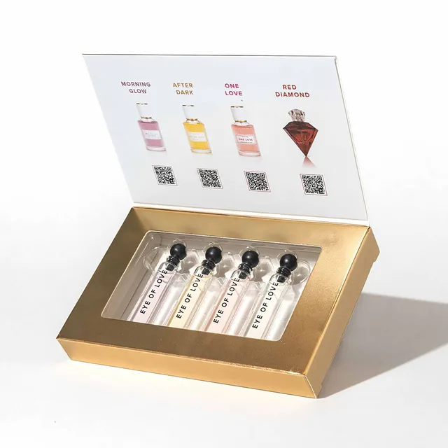 Gold Eye of Love presentation box holding four labeled 2 ml parfum sample vials