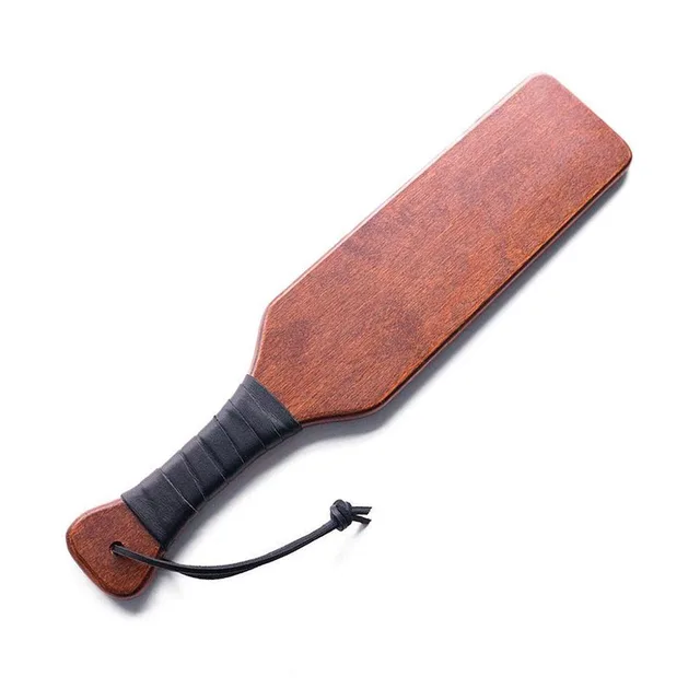 brown rectangular wooden spanking paddle with black leather-wrapped handle and wrist loop