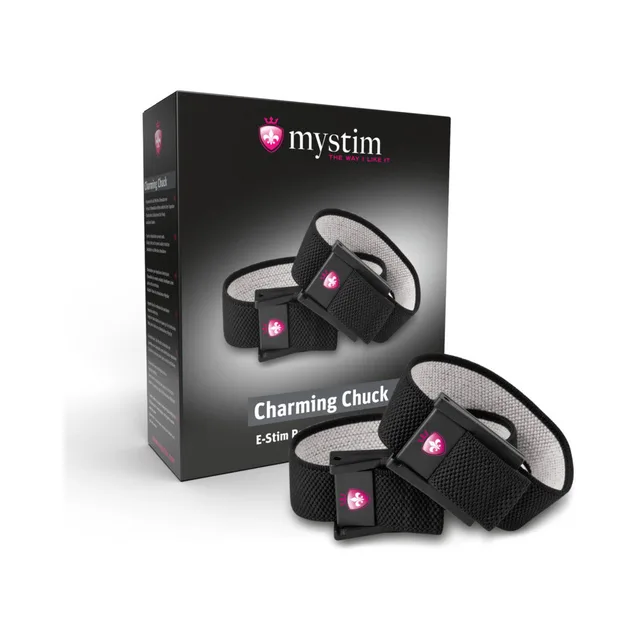 Mystim Charming Chuck black strap set with rectangular pads beside black retail box