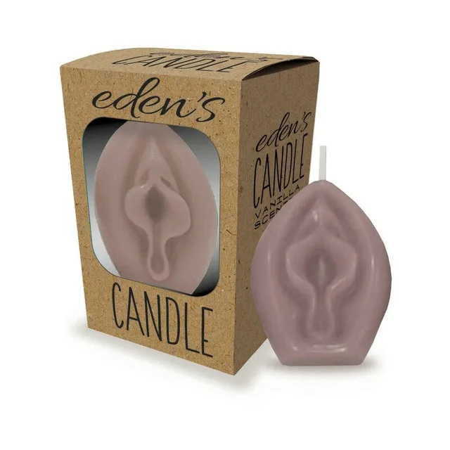 taupe sculpted Eden's vagina candle beside a kraft cardboard window box