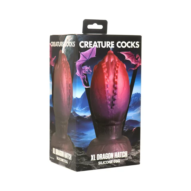 Creature Cocks XL Dragon Hatch dark-red silicone egg in blue mountain and dragon retail box