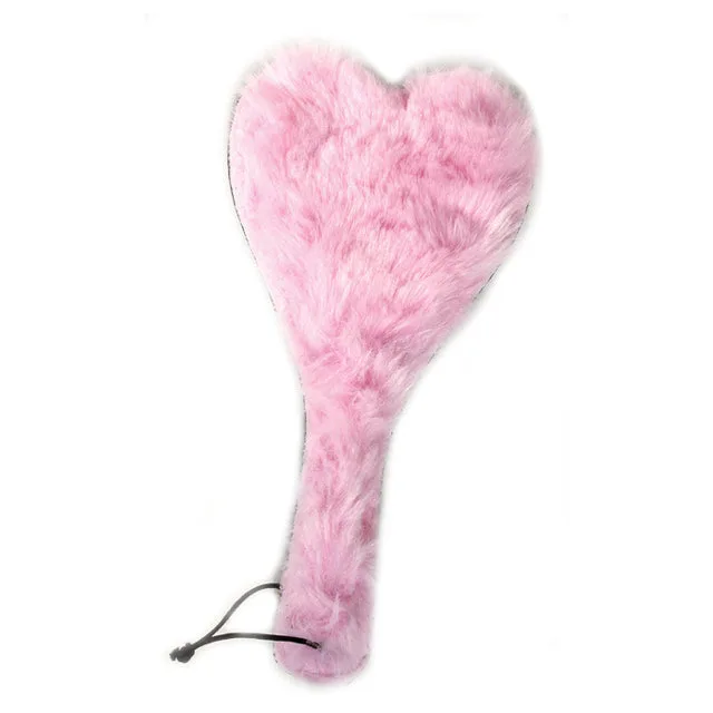 Pink plush heart-shaped leather paddle with wrapped handle and wrist loop
