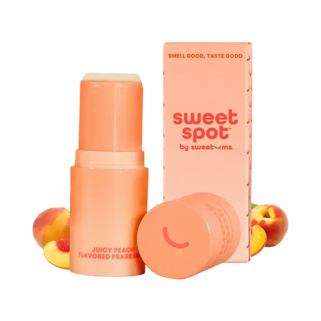 Open Juicy Peach fragrance stick with cap, box and fresh peaches