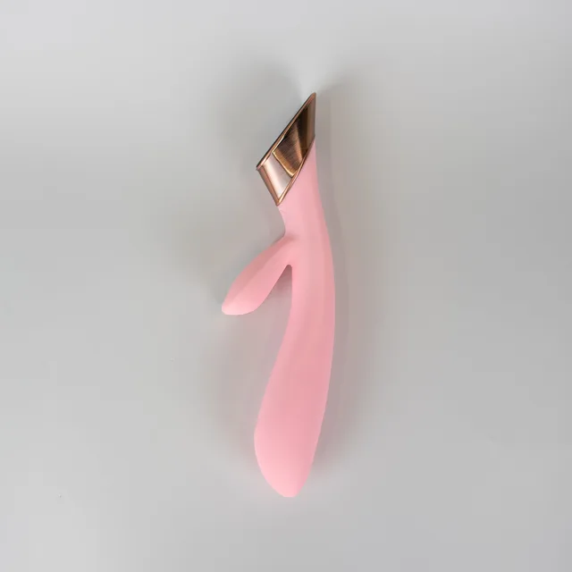 Angled light pink Metis rabbit vibrator with gold trim