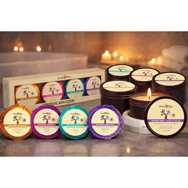 Earthly Body at Night candles and color-coded bath fizzers on counter