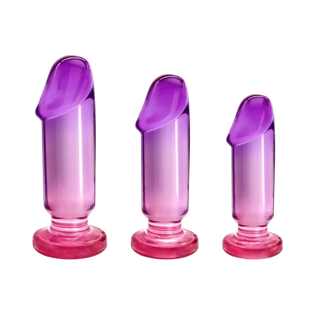 Front view of three translucent pink-purple plugs in graduated heights