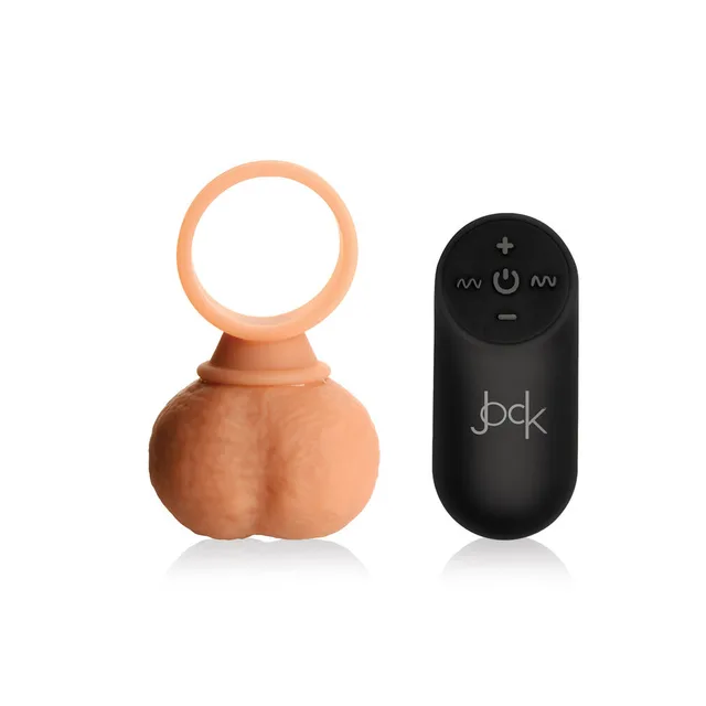 Jock 28x Large ring and balls beside black remote