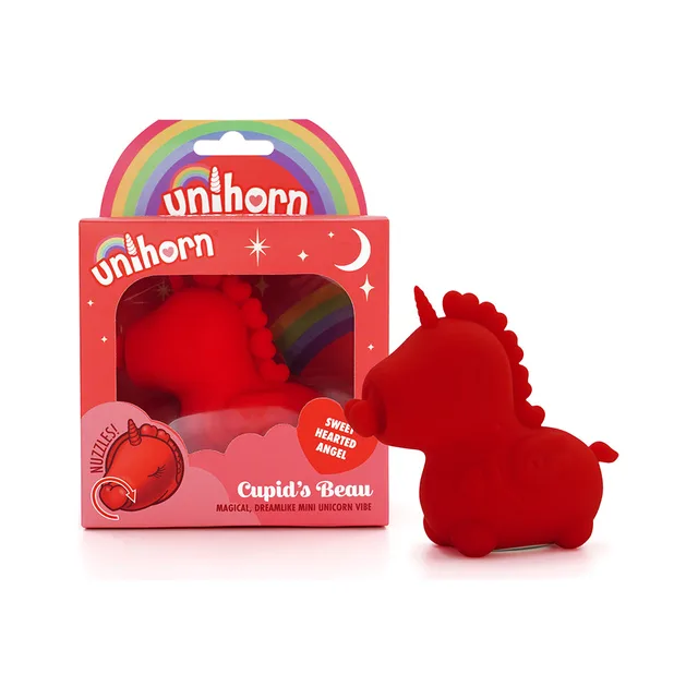 red Unihorn Cupid's Beau angel-shaped vibrator beside rainbow box