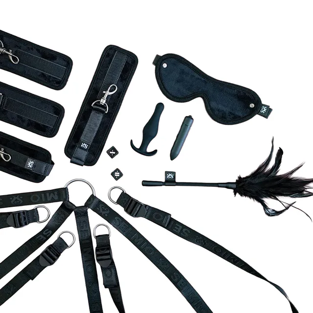 Black Complete Surrender straps, cuffs, blindfold, clips and feather accessory