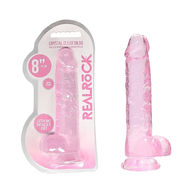 Pink RealRock Crystal Clear 8-inch dildo beside retail blister