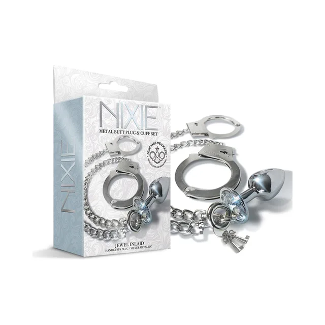Nixie silver jeweled plug and metal handcuff set beside box