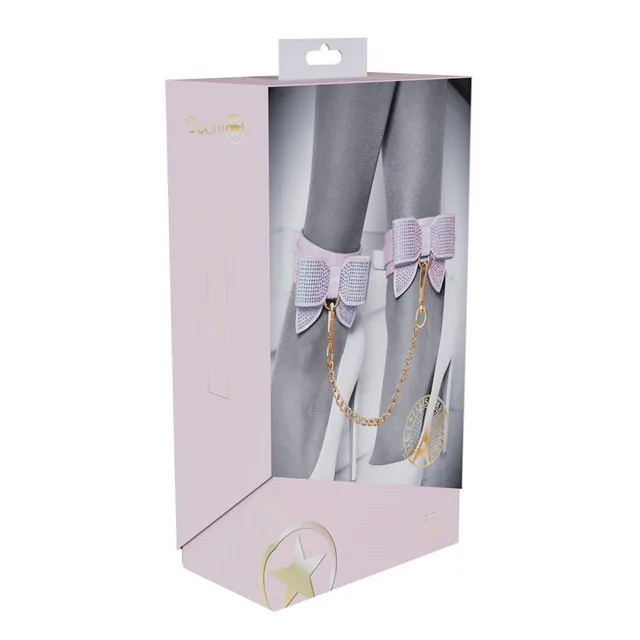 pink Paris Collection leg cuffs with rhinestone bows and gold chain