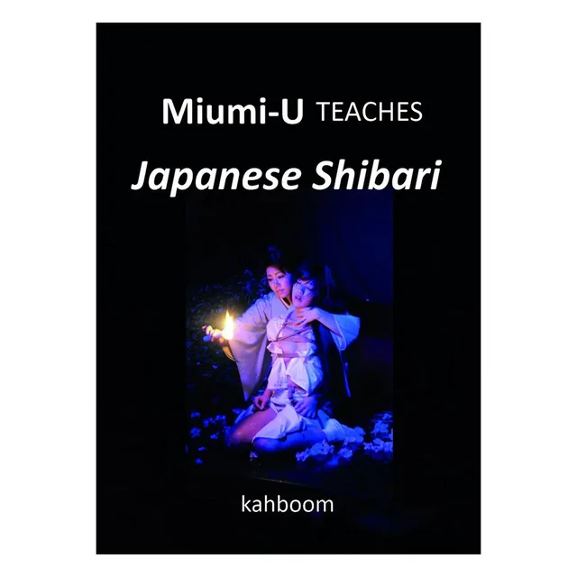 black Miumi-U Japanese Shibari paperback with small blue rope demonstration photograph