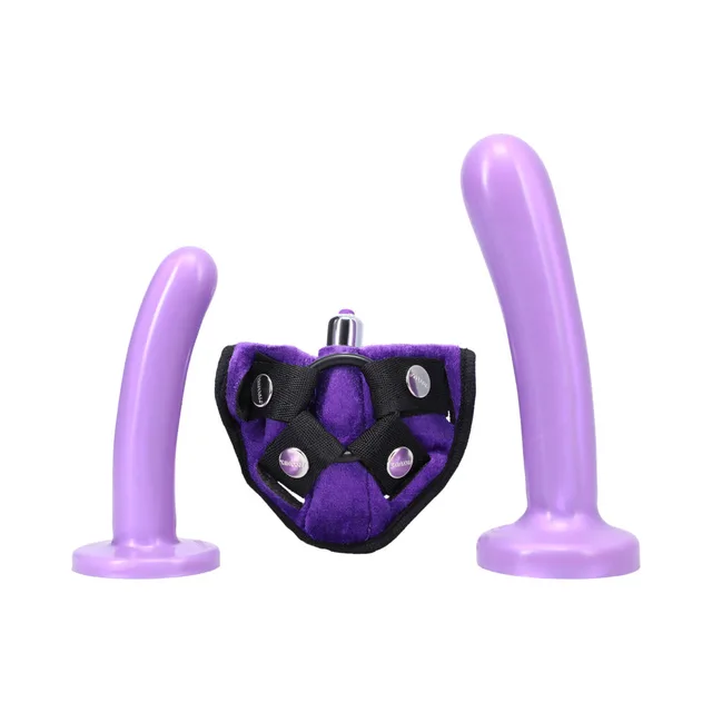 Lavender dildos positioned around purple black harness