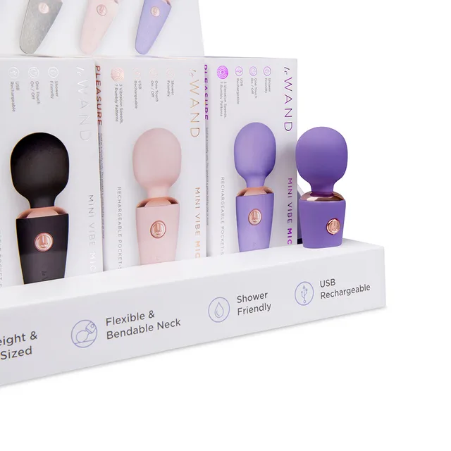 Le Wand Mini Micro 12-piece counter display close-up of black rose-gold violet and white boxes