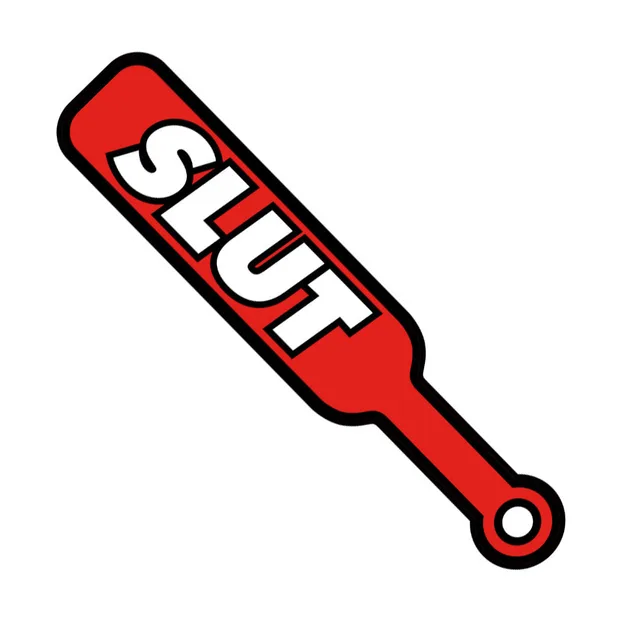 Close-up of red paddle-shaped pin with white SLUT lettering