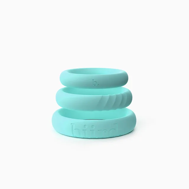 three mint Biird Riin silicone C-rings stacked by size