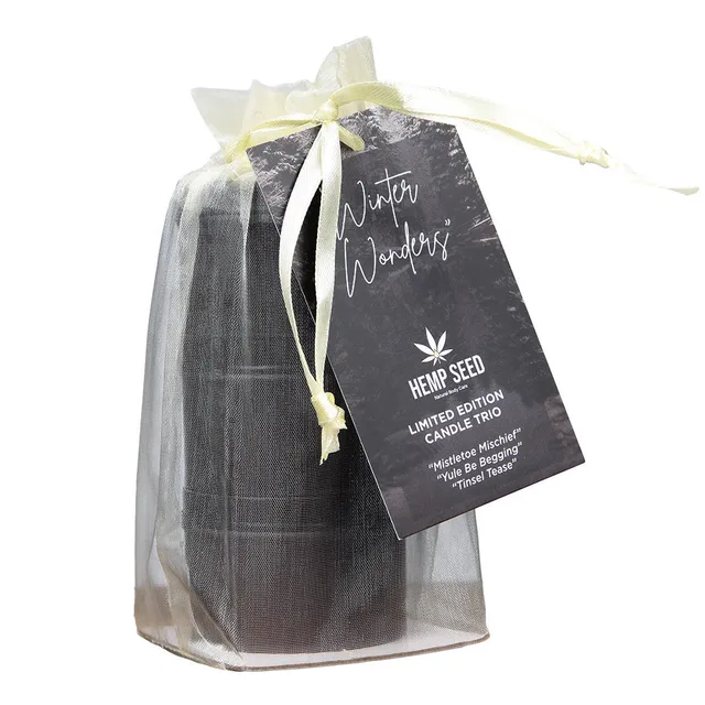 Earthly Body holiday candle trio inside sheer gift bag with hangtag
