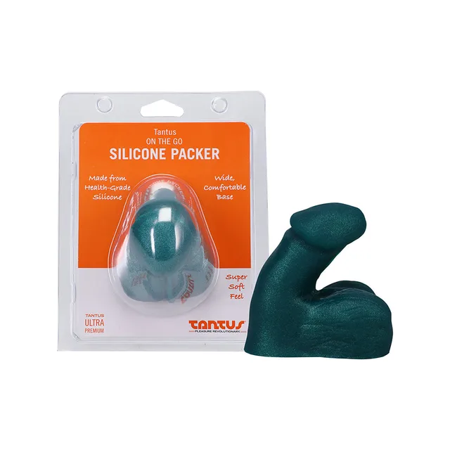Tantus On The Go emerald silicone packer beside front retail package