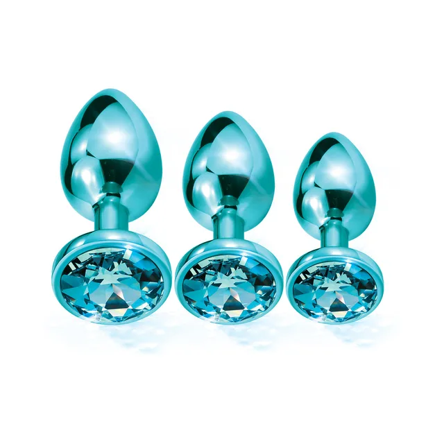Three blue jeweled metal plugs arranged by size