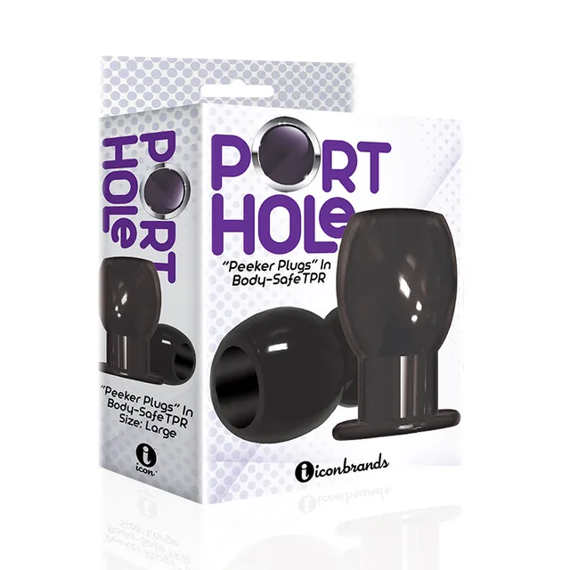 Black Port Hole hollow tunnel plug beside white and black box