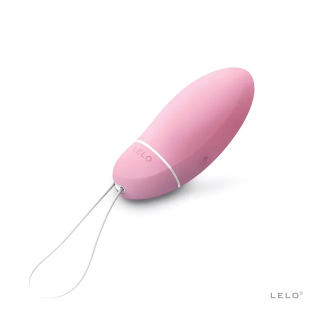 light pink LELO Smart Bead Kegel exerciser with white retrieval cord