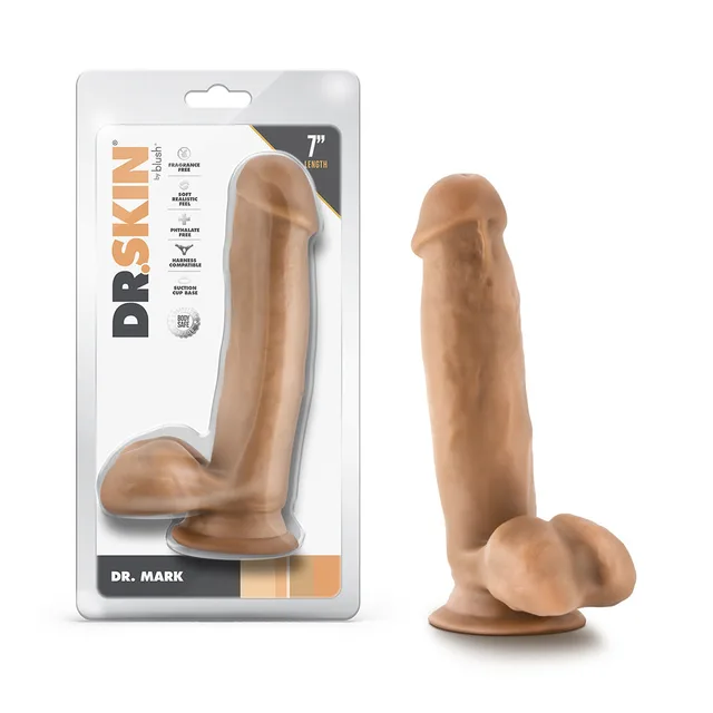 Blush Dr. Skin Dr. Mark tan 7-inch TPE dildo beside front retail package