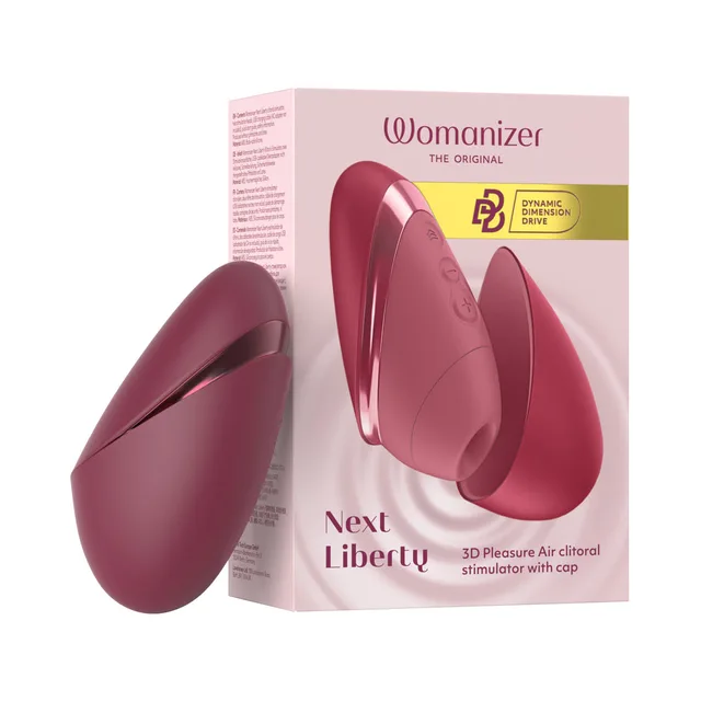 Womanizer Next Liberty Bordeaux clitoral stimulator with protective cover beside the pink retail box
