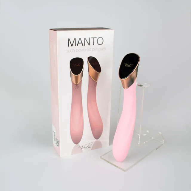 Light pink Viotec Manto vibrator beside retail box and stand