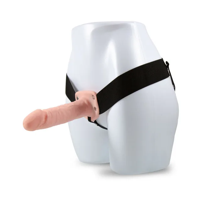 Beige Dr. Skin 7-inch hollow strap-on mounted on mannequin with black harness
