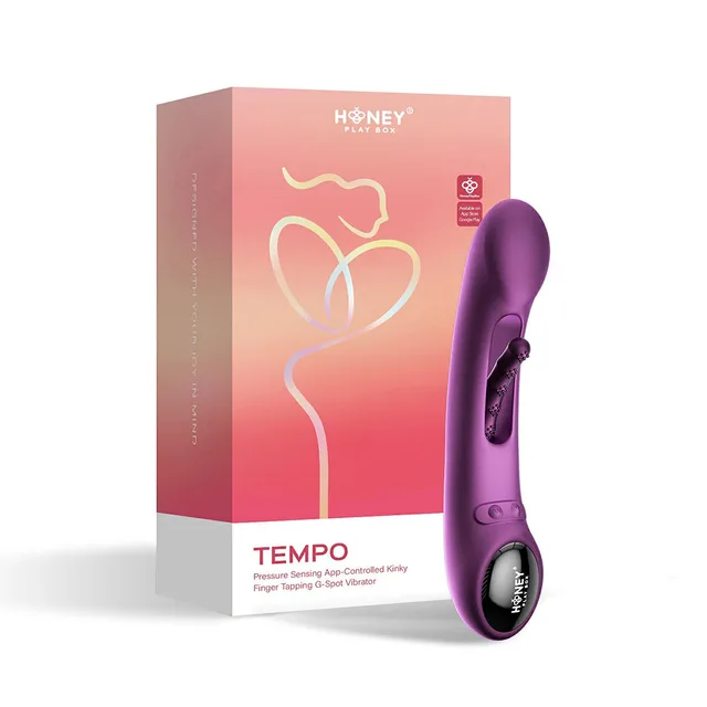 Purple Honey Play Box Tempo pressure-sensing vibrator beside coral retail box