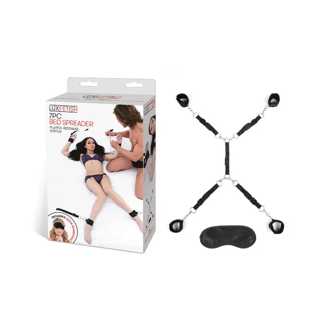 Lux Fetish bed spreader straps and cuffs displayed beside retail box
