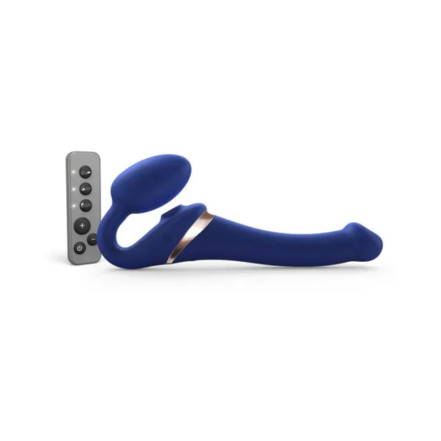 Small night-blue bendable strapless strap-on beside remote