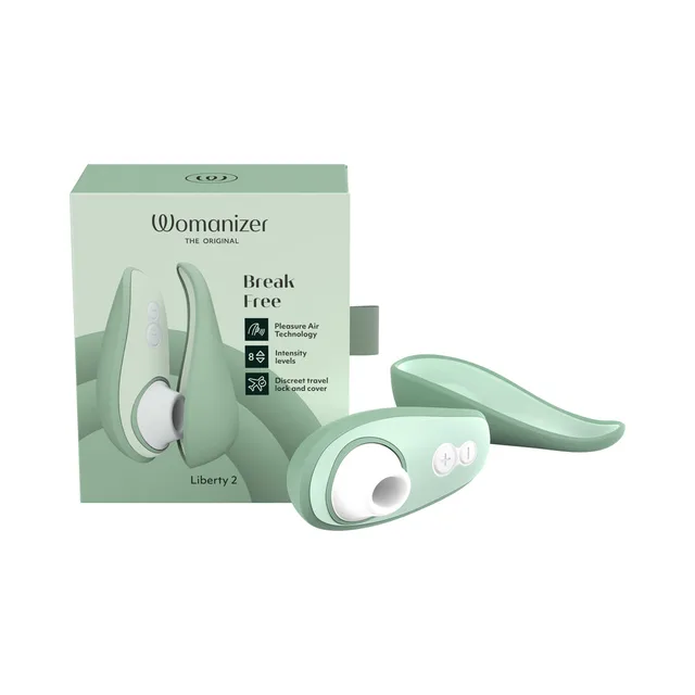 sage Womanizer Liberty 2 with white air head and curved cover beside matching box