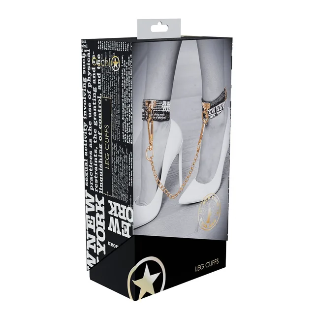 New York text-print leg cuffs with gold connector chain displayed on box